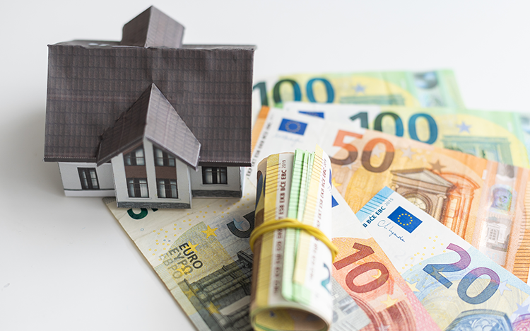 toy house and banknotes