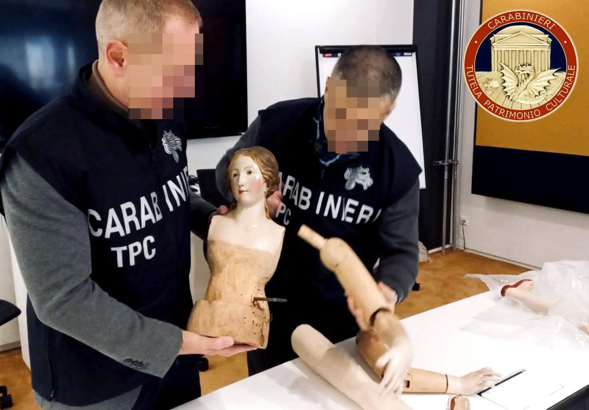 Police handling the religious artefact