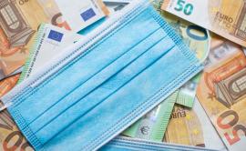 Sanitary face mask on euro notes