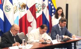 Representatives of Eurojust and AIAMP signing the agreement