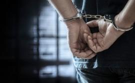 handcuffed individual
