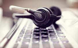 Headphones resting on a computer keyboard