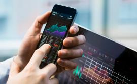 Stock charts on a screen of a mobile phone