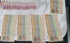 Seized money: Romanian banknotes laid out on a table